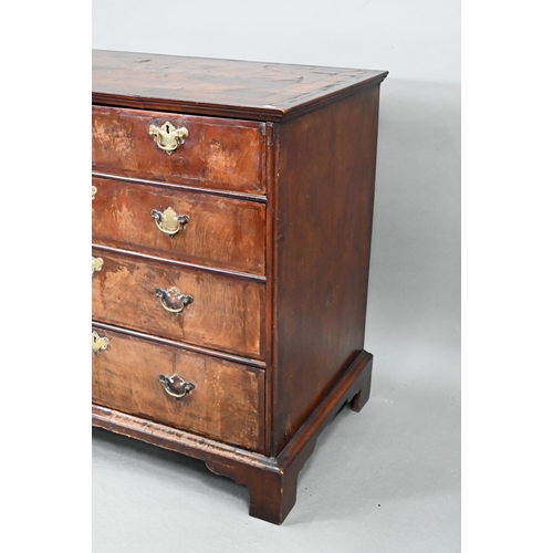 731 - An 18th century feather-banded walnut chest of two short over three long graduated drawers, with bra... 