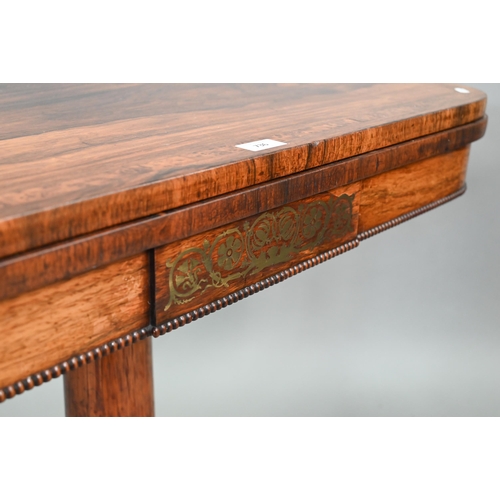 736 - A Regency burr yew cross banded rosewood card table, the fold over top with rounded corners enclosin... 