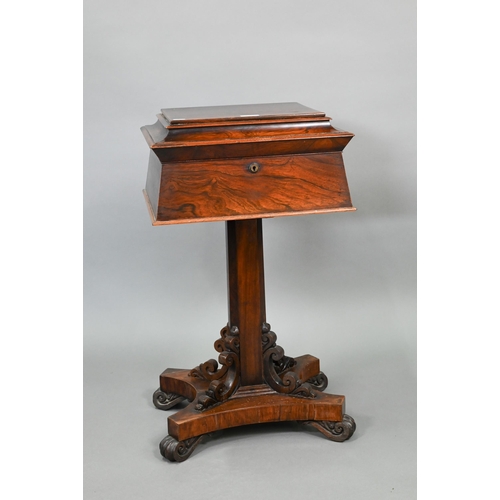 738 - A Regency rosewood sarcophagus form teapoy, the interior with four lidded tea boxes, centred by two ... 