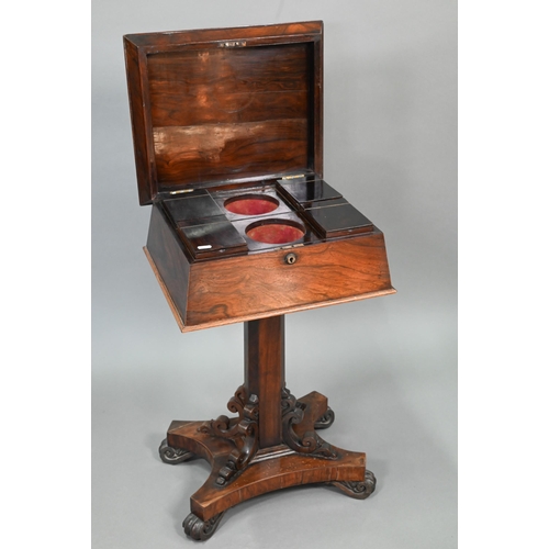 738 - A Regency rosewood sarcophagus form teapoy, the interior with four lidded tea boxes, centred by two ... 