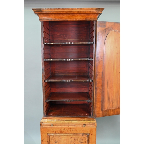 739 - An antique William & Mary style walnut cabinet, in two sections, the shaped canopy over a mirror... 