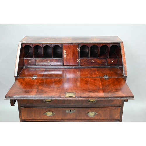 742 - An 18th century feather banded walnut bureau, the fitted interior centred by a cupboard over four lo... 