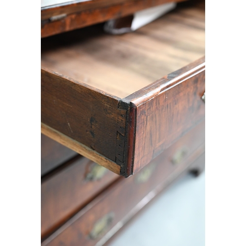742 - An 18th century feather banded walnut bureau, the fitted interior centred by a cupboard over four lo... 