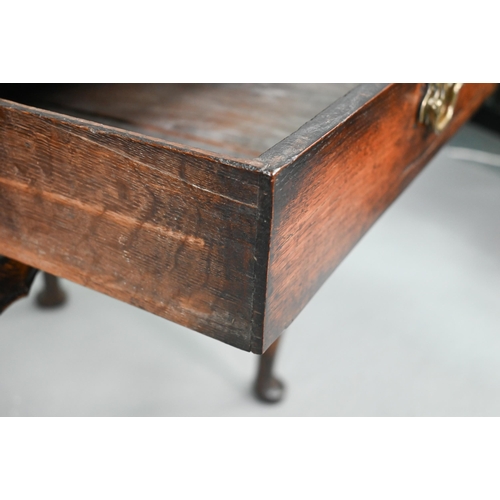 743 - A late 17th/18th century oak single drawer side table, raised on hip moulded cabriole legs, 80 cm x ... 
