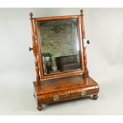 744 - A Regency mahogany platform toilet mirror, with two short drawers and raised on turned gadrooned fee... 