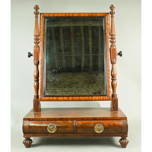 744 - A Regency mahogany platform toilet mirror, with two short drawers and raised on turned gadrooned fee... 
