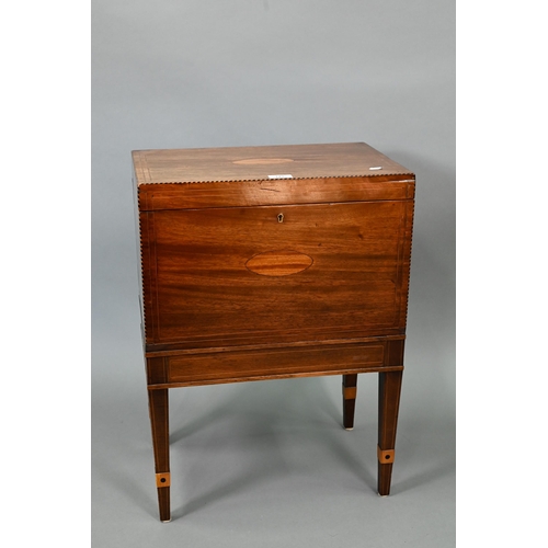 749 - A Victorian inlaid mahogany cellaret, bearing makers plate for Nolan & Sons, Dublin, the interio... 