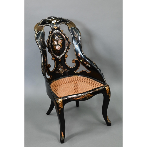 750 - Two Victorian black lacquered gilt and mother-of-pearl inlaid papier mache chairs, with caned seats,... 