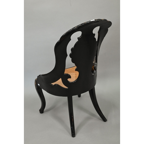 750 - Two Victorian black lacquered gilt and mother-of-pearl inlaid papier mache chairs, with caned seats,... 