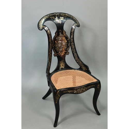750 - Two Victorian black lacquered gilt and mother-of-pearl inlaid papier mache chairs, with caned seats,... 