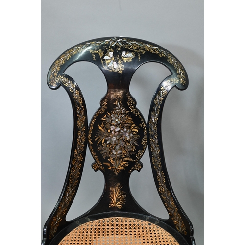 750 - Two Victorian black lacquered gilt and mother-of-pearl inlaid papier mache chairs, with caned seats,... 
