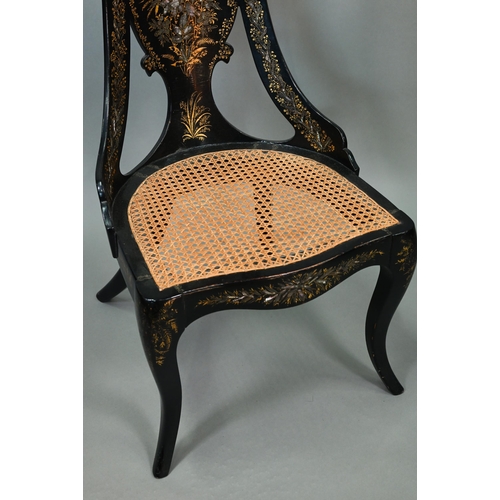 750 - Two Victorian black lacquered gilt and mother-of-pearl inlaid papier mache chairs, with caned seats,... 