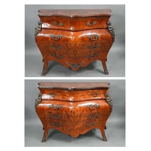 A pair of continental Louis XV style burr walnut, kingwood and gilt metal mounted serpentine commodes, with four long graduated drawers over a shaped apron and splayed legs, 20th century, (2)