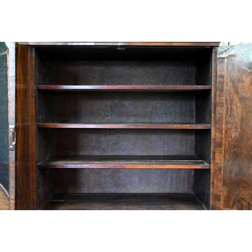 758 - An 18th century and later walnut two part cabinet on chest, the moulded cornice over a pair of mould... 