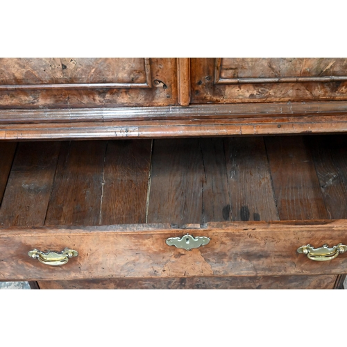 758 - An 18th century and later walnut two part cabinet on chest, the moulded cornice over a pair of mould... 