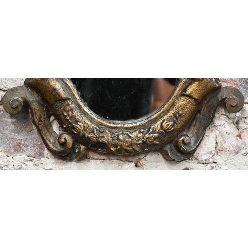 760 - An antique carved giltwood framed cartel form mirror, 52 cm x 32 cm h