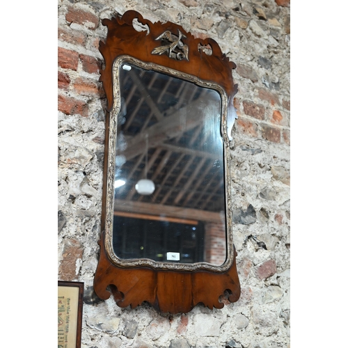 761 - A 19th century yew fet cut mirror, with gilt slip, the crest centred by a ho-ho bird device, 94 h cm... 