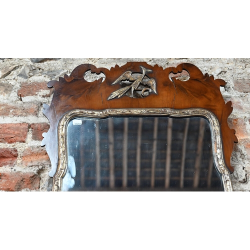 761 - A 19th century yew fet cut mirror, with gilt slip, the crest centred by a ho-ho bird device, 94 h cm... 