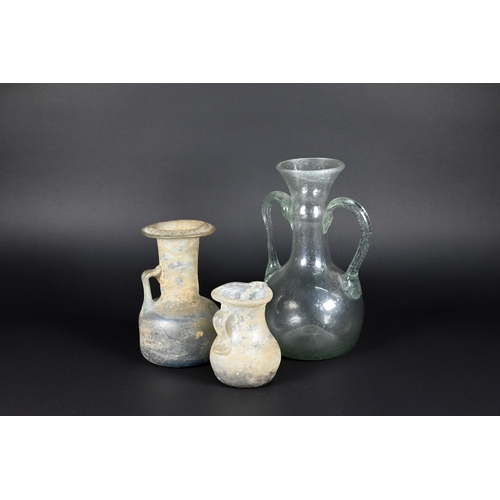 906 - Two Mediterranean antiquity glass jugs, 12/8 cm to/w a similar, later jar (3)