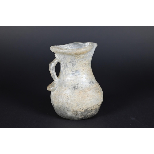 906 - Two Mediterranean antiquity glass jugs, 12/8 cm to/w a similar, later jar (3)