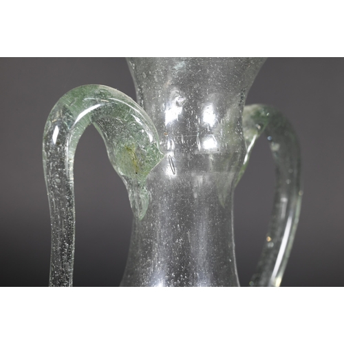 906 - Two Mediterranean antiquity glass jugs, 12/8 cm to/w a similar, later jar (3)