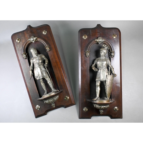 918 - Two 19th century French spelter figures of Medieval King and Prince in armour, mounted in stained wo... 