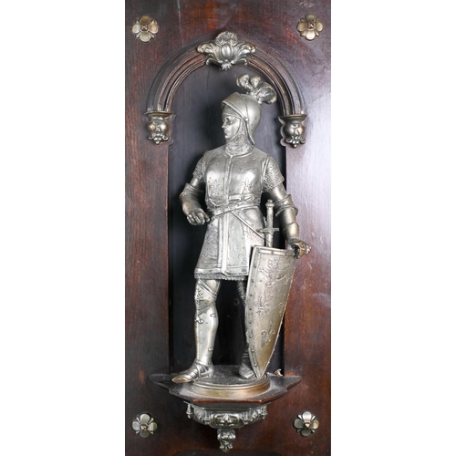 918 - Two 19th century French spelter figures of Medieval King and Prince in armour, mounted in stained wo... 