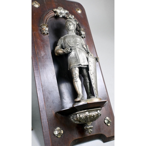 918 - Two 19th century French spelter figures of Medieval King and Prince in armour, mounted in stained wo... 