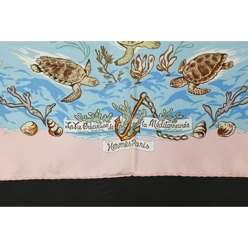 926 - Hermés - Two boxed silk scarves featuring sea creatures and purple stamps, rolled edges, 87 x... 