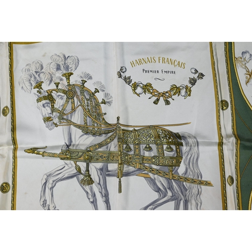 927 - Hermés - Two silk scarves featuring green horses and feathers, rolled edges, one box, 87 x 87 cm (2)... 