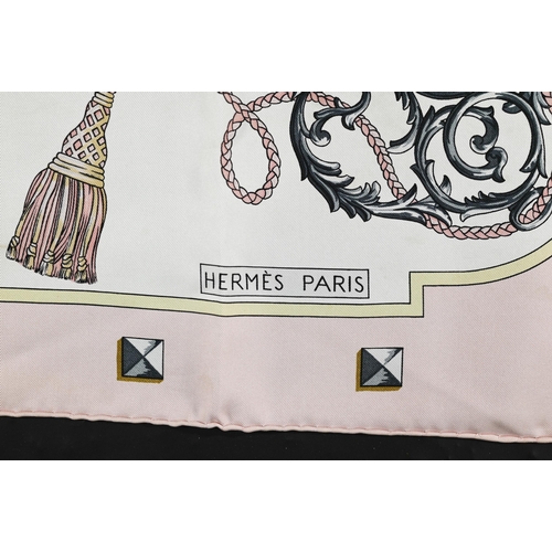 928 - Hermés - Two boxed silk scarves featuring pastel links and pink keys, rolled edges, 87 x 87 c... 