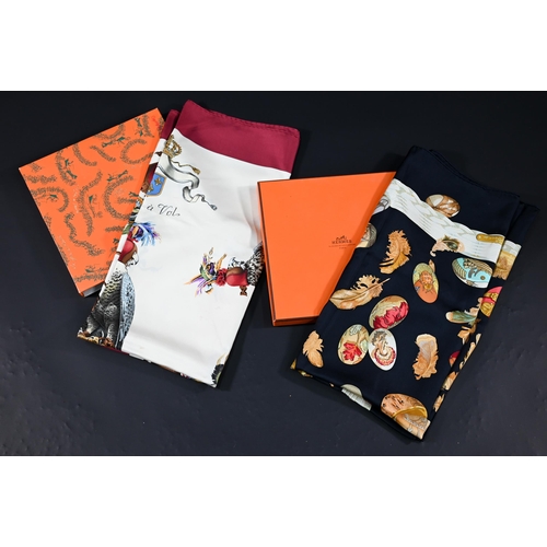 929 - Hermés - Two boxed silk scarves - red hawks and navy egg, rolled edges, 87 x 87 cm (2)Some di... 