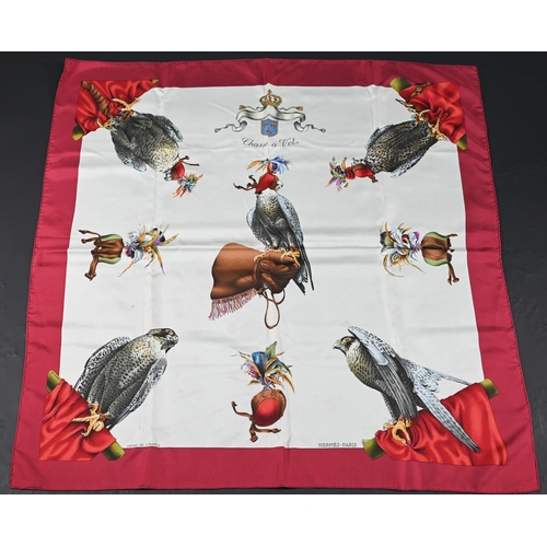 929 - Hermés - Two boxed silk scarves - red hawks and navy egg, rolled edges, 87 x 87 cm (2)Some di... 