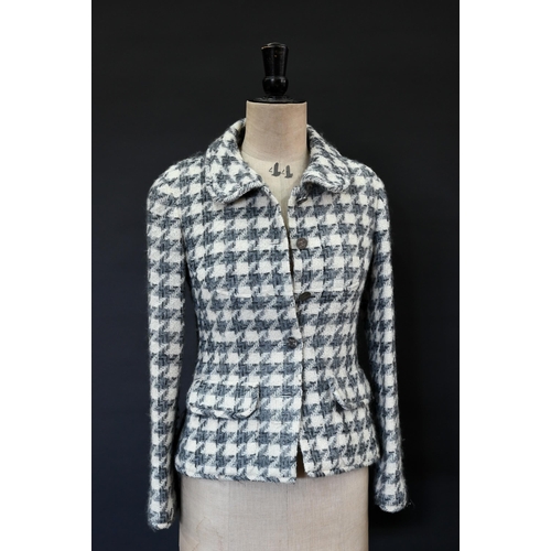 934 - Chanel Boutique - A grey and ecru houndstooth wool fitted jacket with rounded collar and front pocke... 