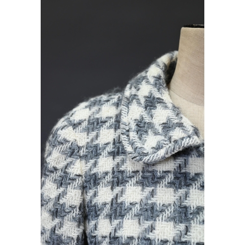 934 - Chanel Boutique - A grey and ecru houndstooth wool fitted jacket with rounded collar and front pocke... 