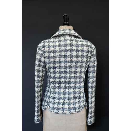 934 - Chanel Boutique - A grey and ecru houndstooth wool fitted jacket with rounded collar and front pocke... 