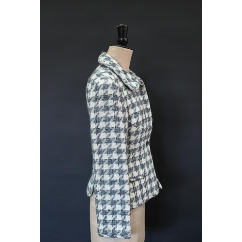 934 - Chanel Boutique - A grey and ecru houndstooth wool fitted jacket with rounded collar and front pocke... 