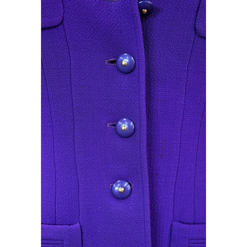 935 - Chanel Boutique - A long purple fitted wool single breasted jacket with double lapel collar and brea... 