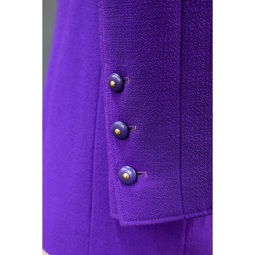 935 - Chanel Boutique - A long purple fitted wool single breasted jacket with double lapel collar and brea... 