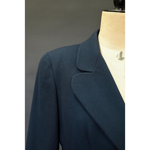 936 - Chanel Boutique - A navy fine wool double breasted blazer with double lapels, pockets and gilt metal... 