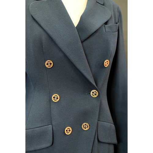 936 - Chanel Boutique - A navy fine wool double breasted blazer with double lapels, pockets and gilt metal... 