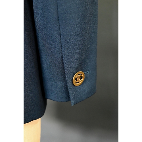 936 - Chanel Boutique - A navy fine wool double breasted blazer with double lapels, pockets and gilt metal... 