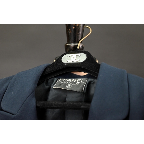 936 - Chanel Boutique - A navy fine wool double breasted blazer with double lapels, pockets and gilt metal... 