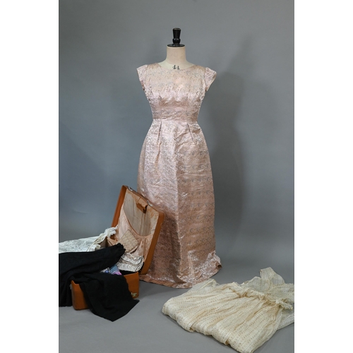 938 - A 1950s pink and gold Chinese brocade evening gown by Caley's of Windsor; a cream and gold gauze dre... 