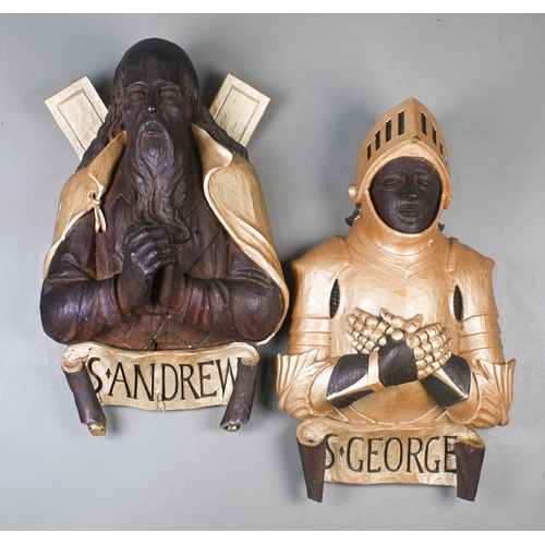 948 - Two Victorian carved oak half-length figures of St George and St Andrew, wall-mounting, with gold pa... 