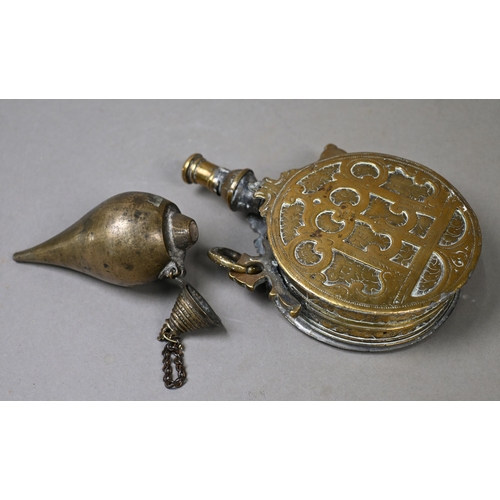 958 - An antique Ottoman brass powder-flask of drum form with foliate decoration, 11.5 cm diam to/w a Mugh... 