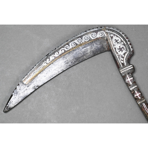 959 - An Afghan Lohar (axe) with inlaid gold and silver on steel blade and shaft, on brass-mounted and sil... 