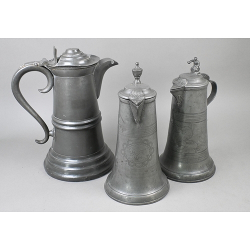 972 - Two 19th century German pewter flagons with wrigglework decoration, dated 1858/64, 29 cm high c/w a ... 