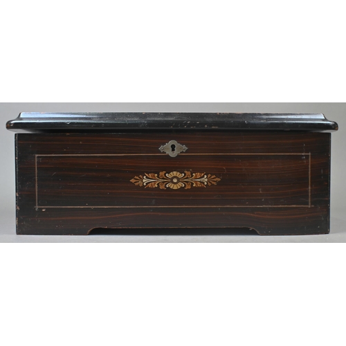 975 - An inlaid rosewood Swiss musical box with clockwork movement playing six airs, 36 cm wide