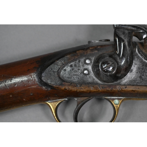 957 - An 1858 pattern 'Tower' musket with percussion action 82 cm barrel, brass-mounted walnut half-stock,... 